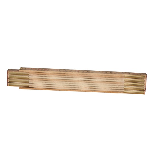 Wooden folding ruler with brass joints, closed and laid flat on a white background.