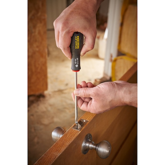 Photo of STANLEY 0-65-141 screwdriver used to install door lock hardware.