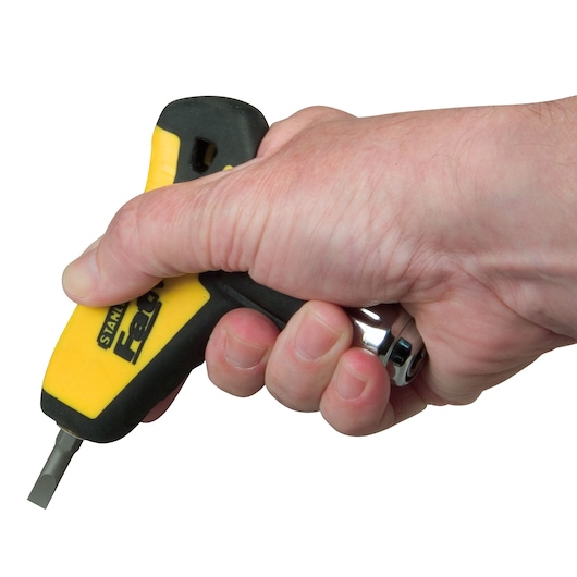 Photo of a hand holding a STANLEY 0-79-153 ratcheting screwdriver, ergonomic yellow and black handle, side view.