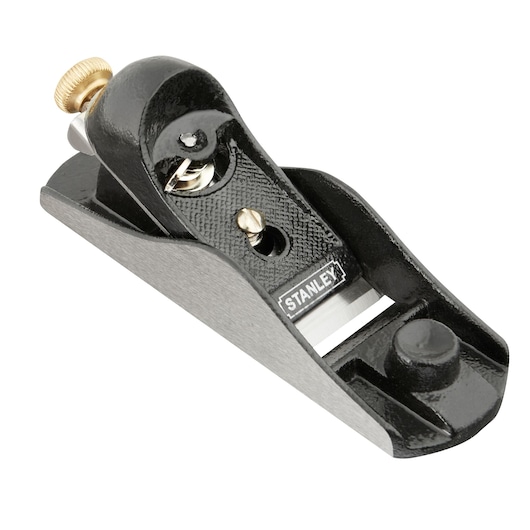 STANLEY 1-12-220 block plane, black and silver hand tool, three-quarter angle, metal adjustment knob.