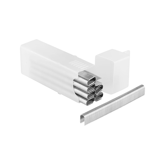 Close-up of metal staples arranged in stacks, with a white plastic case partially visible in the background.