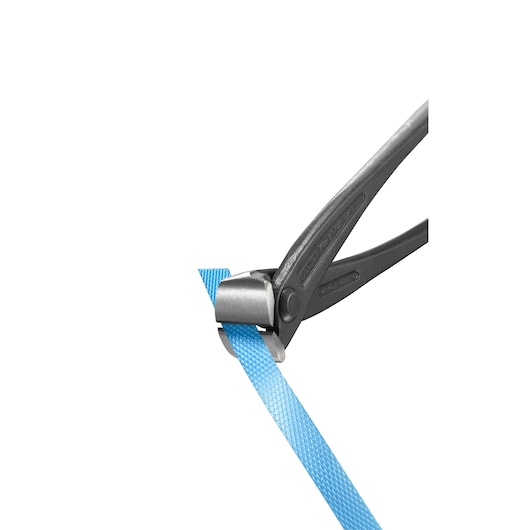 STANLEY 4-95-098 hand strapping tool gripping blue plastic band, close-up, white background.