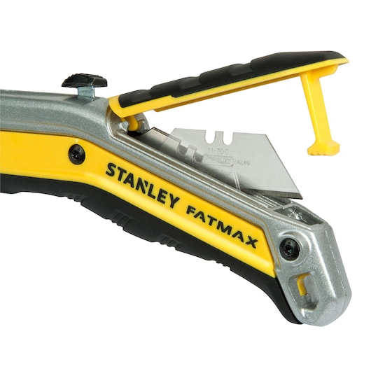 STANLEY FMHT0-10288 utility knife with yellow and black handle, blade exposed, side angle on white background.