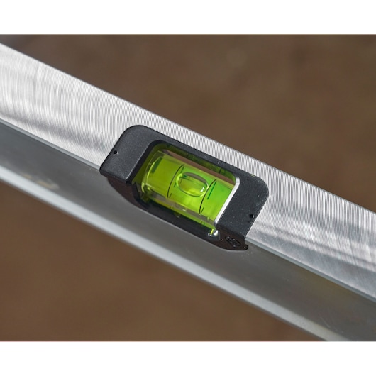 STANLEY FMHT43679-1 spirit level close-up, showing green vial and silver body.