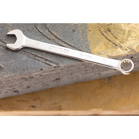 STANLEY FMMT13030-0 combination spanner, silver, 13mm, product photography on concrete surface.