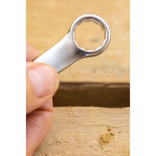 STANLEY FMMT13042-0 wrench close-up held by hand, metallic finish, photography of tool head.