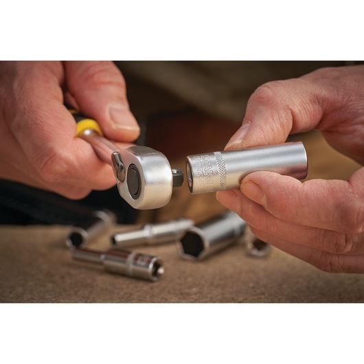 Photo of STANLEY FMMT17249-0 socket being attached to ratchet wrench, other sockets in background.