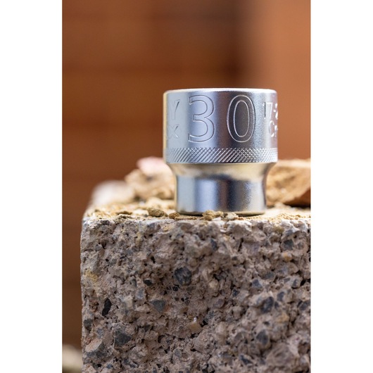 STANLEY FMMT82685-1 chrome socket, 30mm size, close-up on concrete block.
