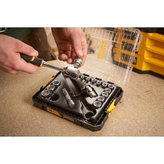Stanley FMMT98102-0 socket set with ratchet handle, open case, photo on workbench.