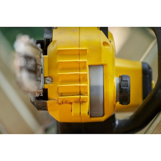 STANLEY SFMCCS730M1 chainsaw close-up showing yellow body with black handle and oil level window.