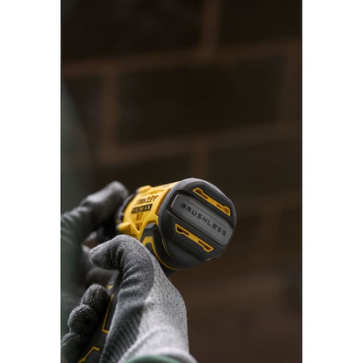 STANLEY SFMCD715D1K brushless cordless drill, close-up view in gloved hands.