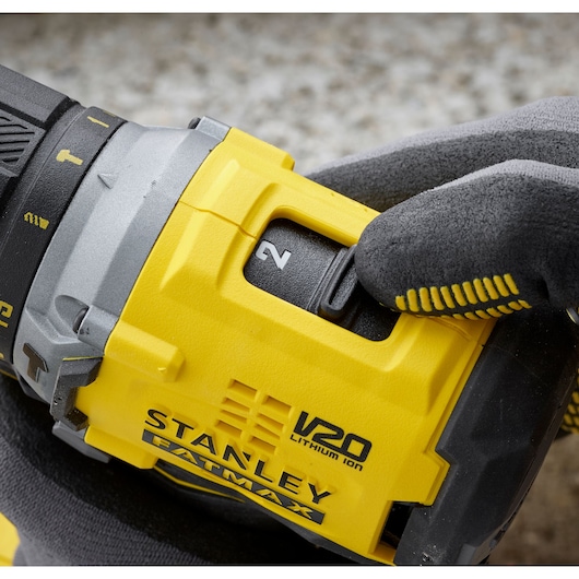 Photo of STANLEY SFMCD715D2K V20 FATMAX drill close-up showing speed switch and yellow body.