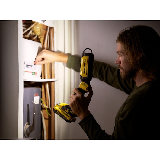 STANLEY SFMCL050B 18V STANLEY FATMAX V20 Pivot Light used to illuminate electrical panel.