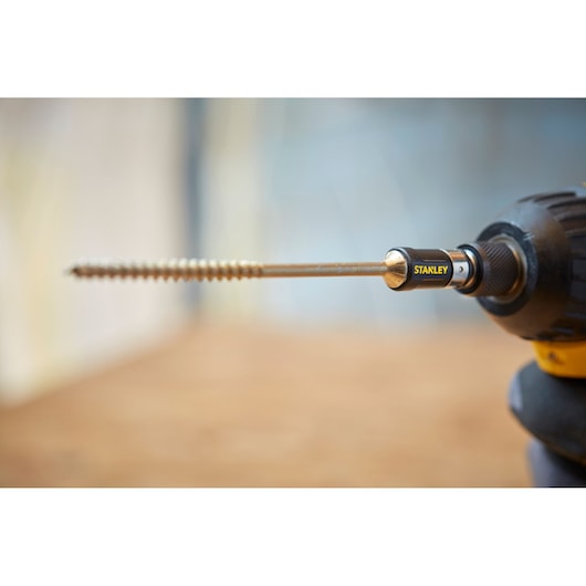 Photo of STANLEY STA88558 screwdriver bit set attached to a power drill viewed from the side.
