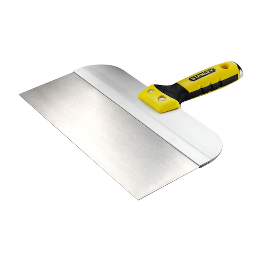 STANLEY STHT0-05771 plastering knife with wide stainless steel blade and yellow-black ergonomic handle, angled view.