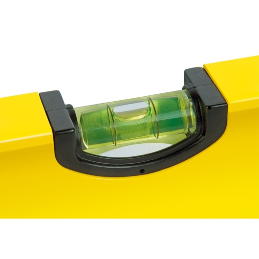 STANLEY STHT1-43103 spirit level close-up photo, yellow body with green vial on white background.