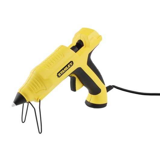 Yellow Stanley electric hot glue gun with stand and cord, shown on a white background.