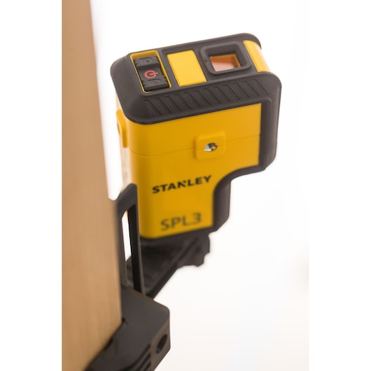 STANLEY STHT77503-1 yellow SPL3 laser level close-up angled with visible buttons.