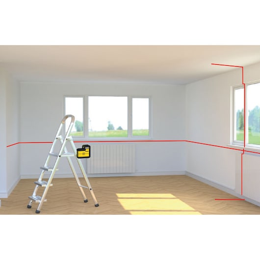 STANLEY STHT77504-1 laser level placed on ladder in bright room, projecting red laser lines horizontally and vertically.