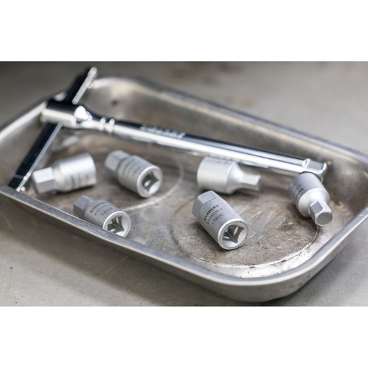 STANLEY STHT81578-0 socket set and wrench on a metal tray, silver finish, product photography.