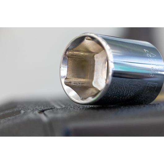STANLEY STMT86112-0 chrome socket close-up, tool photography on black textured surface.