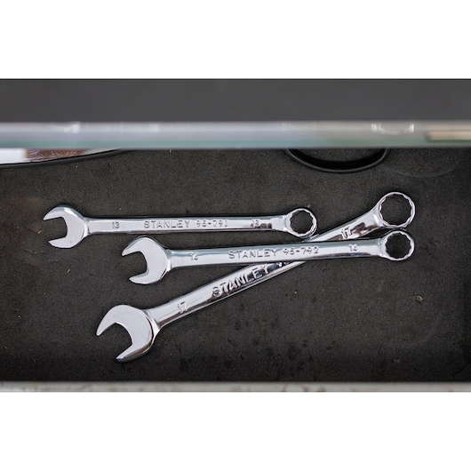 Photo of STANLEY STMT95911-0 chrome combination wrenches set in a drawer, top view.