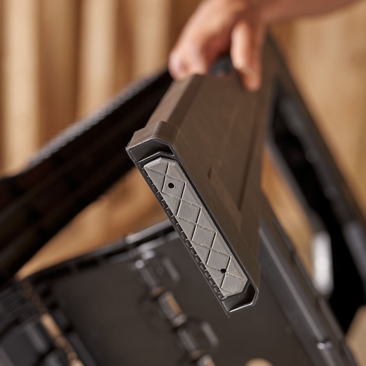 STANLEY STST1-70355 black plastic toolbox corner with diamond pattern, close-up view.