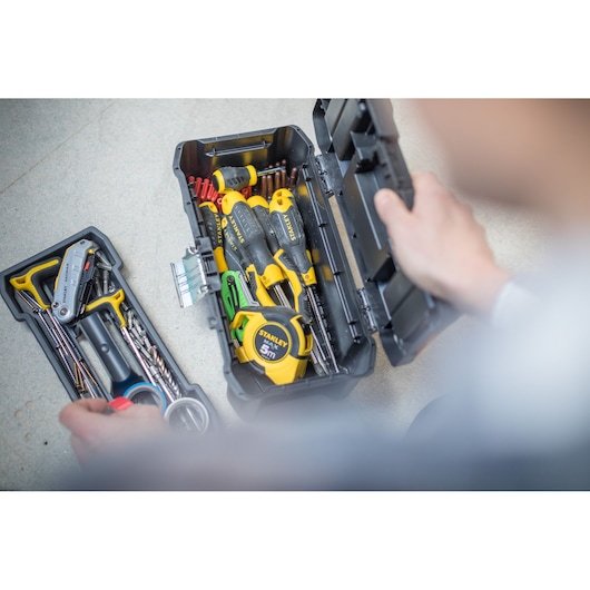 STANLEY STST1-75515 toolbox with assorted hand tools and tape measure, photography from above.