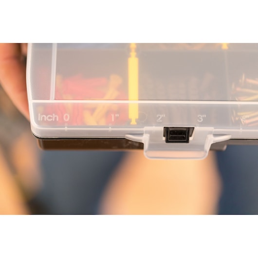 STANLEY STST81681-1 photography of plastic organizer lid with inch scale and latch, close-up view.